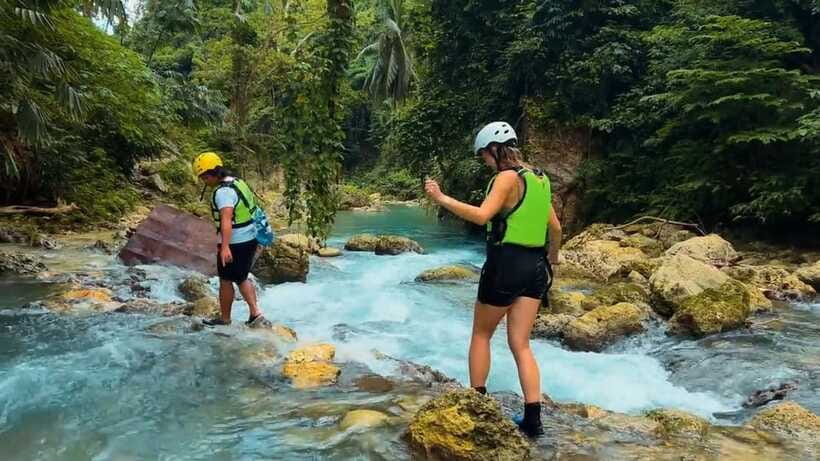 Cebu: Kawasan Falls Canyoneering Tour with Ziplining & Lunch - Canyoneering at Kawasan Falls: Trek, Slides, Swims, and Jumps