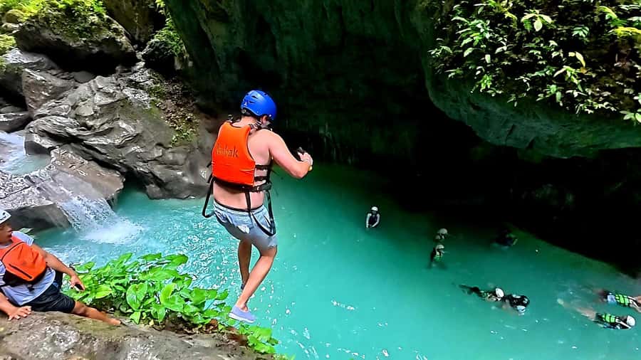 Cebu: Osmeña Peak and Kawasan Canyoneering Day Tour - Kawasan Falls canyoneering: jumps, slides, swims, and real guidance
