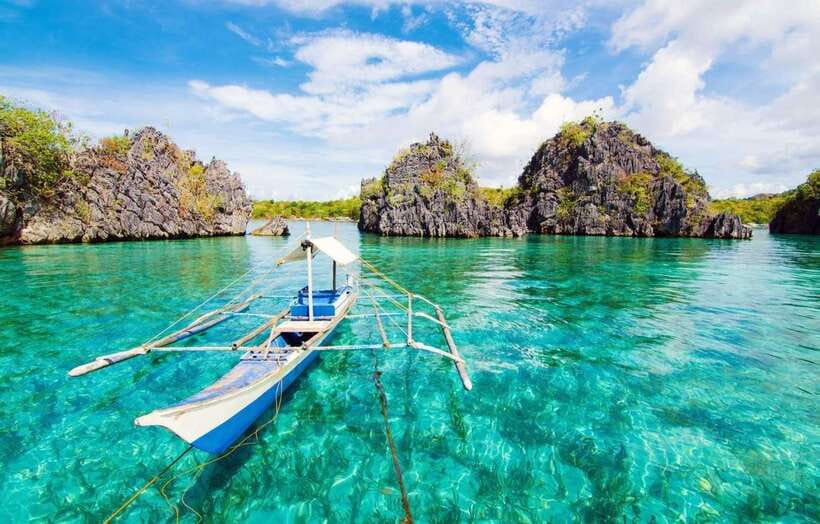 Coron: Coastal Cliffs, Beach & Malcapuya Island Hopping Tour - Downtown Coron pickup and the local banca ride