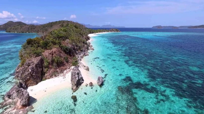 Coron: Coastal Cliffs, Beach & Malcapuya Island Hopping Tour - Malcapuya Island: the main event for snorkeling and beach color