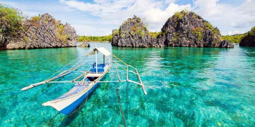 Coron: Coastal Cliffs, Beach & Malcapuya Island Hopping Tour - Bulog Dos Island: photos, tanning, and a calmer feel