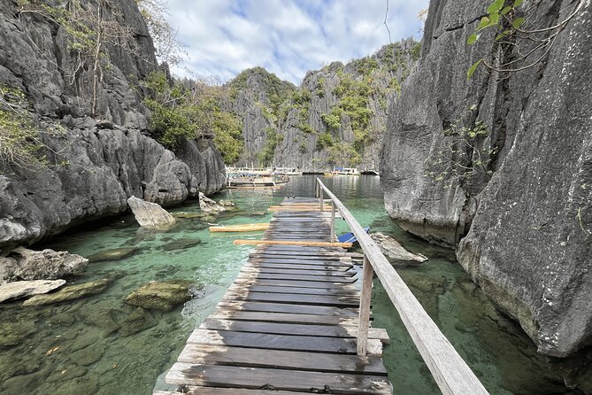 Coron Island Ultimate Tour: Private Boat and Tour Guide - Kayangan Lake: the limestone hill climb and the payoff swim