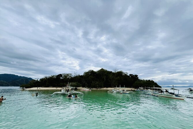 Coron Island Ultimate Tour: Private Boat and Tour Guide - Twin Peaks Coral Garden and Balinsasayaw Reef stops that reward slow snorkeling