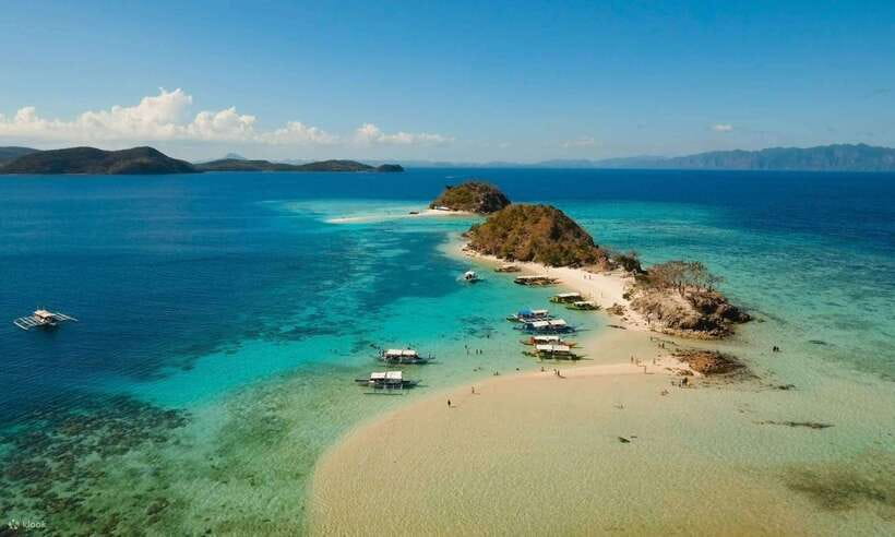 Coron Town: Coron Island Escapade Private Tour with Lunch - Malcapuya Island: white sand and crystal-blue water under palms