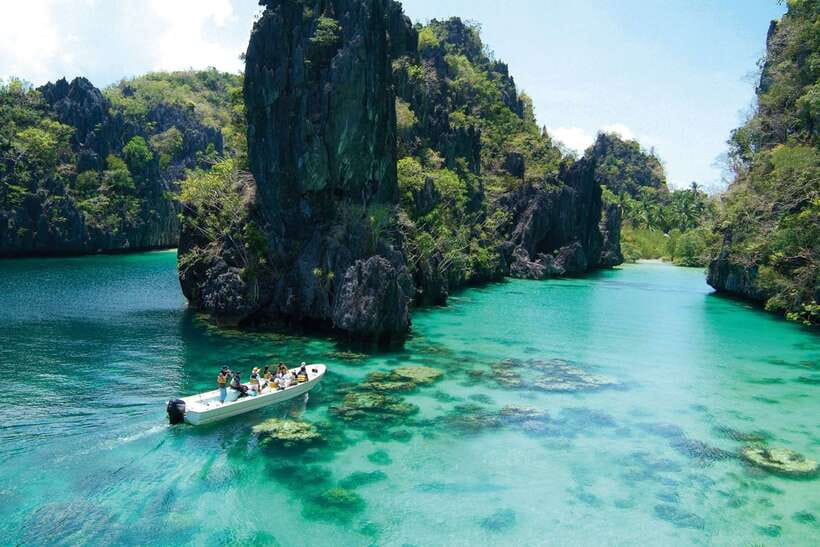 El Nido: Island Hopping Tour A Lagoons and Beaches - Bacuit Bay, up to four stops, and the pace of the day