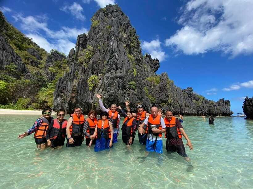 El Nido Tour C: Explore Hidden & Secret Beach Adventure - Talisay Beach for lunch: shaded break plus grilled food