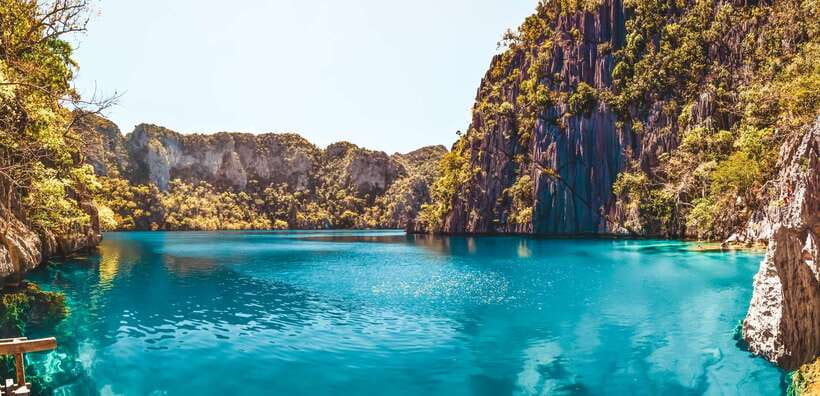 From Coron: Island Hopping Boat Day Trip with Buffet Lunch - Malcapuya Island and the Coastal Cliffs You See From the Boat