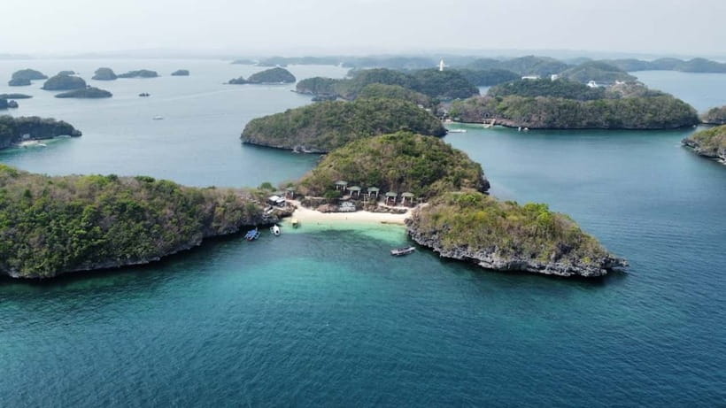 From Manila: Pangasinan Hundred Islands Guided Tour - Island hopping flow: how the day shifts from trekking to water