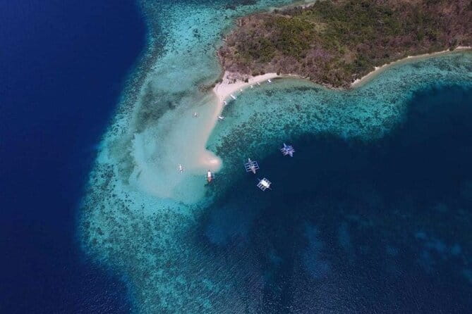 Full Day Coron Super Ultimate Tour - Twin Lagoon: two water sections and limestone cliffs