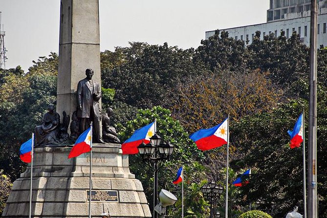 Manila Old and New: Sightseeing Tour Including Intramuros and Fort Santiago - Nielson Tower, Forbes Park, and the drive that turns into real context