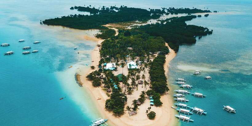 Puerto Princesa: Honda Bay Island Hopping & Optional Massage - Cowrie Island: the long beach day with lunch and massage options