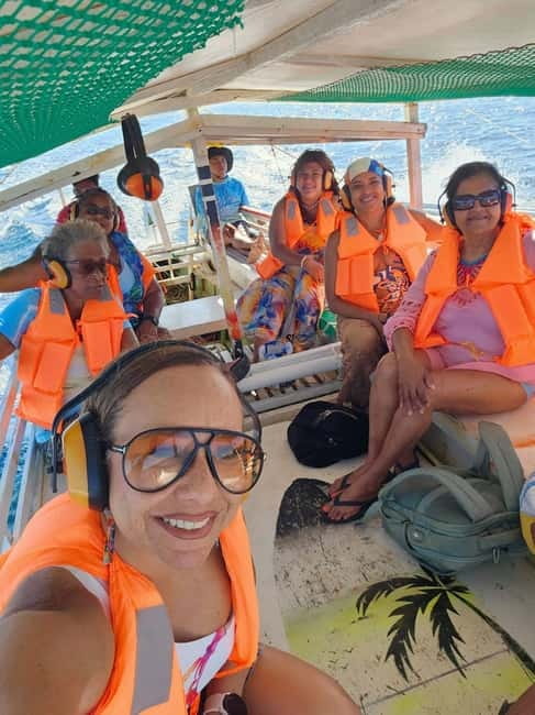 Siargao: Jellyfish Sohoton Cove Tour with Lunch and Pickup - Magkukuob Cave: helmet rules, torch-lit cave exit, and the cliff jump
