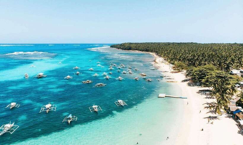 Siargao Tour A (shared tour) - Daku Island: big beach energy, clear water, and boat-crowd logistics